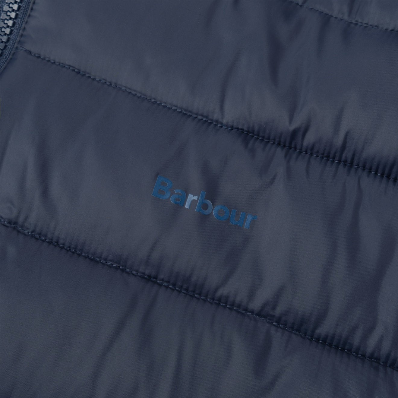 Barbour Benton Quilt Jacket Navy logo detail on quilted fabric