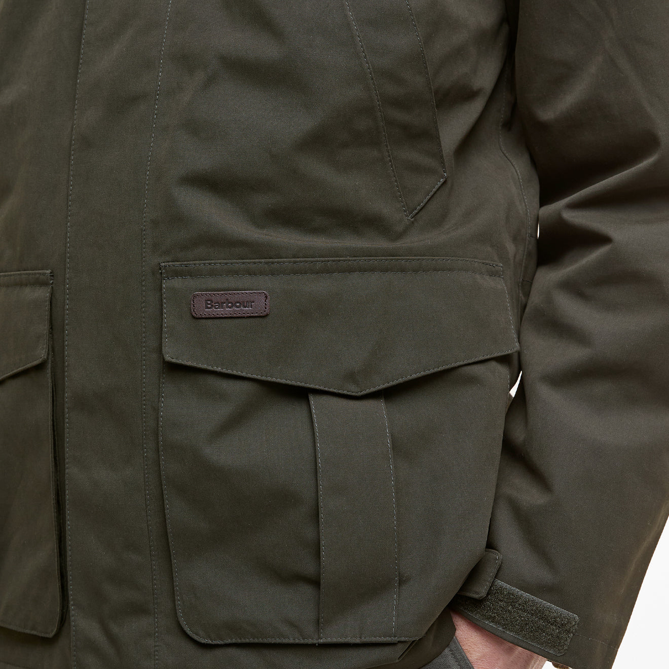 Barbour Brockstone Jacket Dark Olive chest pocket detail with flap, logo tab and waxed fabric finish