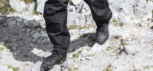 Man hiking on rocky UK trail wearing Adidas Terrex hiking shoes
