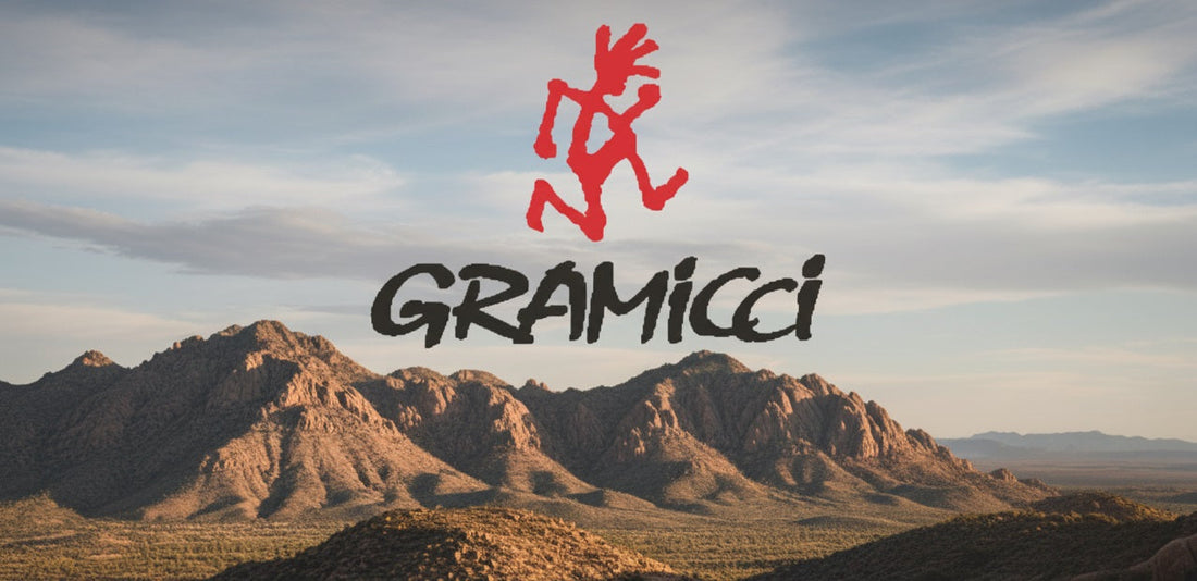 Gramicci clothing brand banner above rugged mountain landscape, reflecting the label’s roots in climbing and outdoor wear