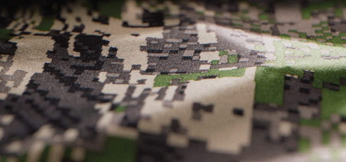 Close-up of Sitka Optifade camouflage fabric showing digital pattern designed around animal vision and natural terrain