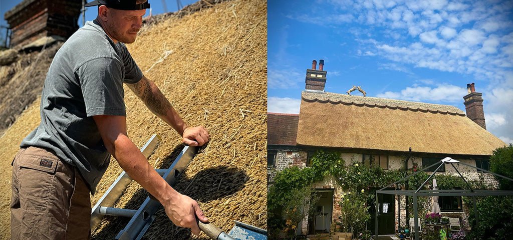 Thatcher Shane Stevens working on a traditional thatched roof, with a completed cottage showcasing his craftsmanship under a blue sky.