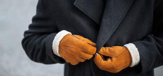Man wearing a pair of Brown Leather Hestra Gloves