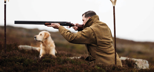 Man wearing Tweed Hard Wearing Country Attire with Dog