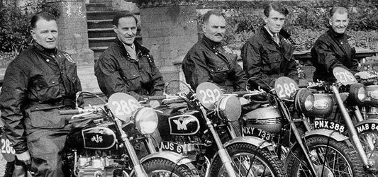 Five Men Sitting on Vintage Motorcycles wearing Classic Barbour Wax Jackets