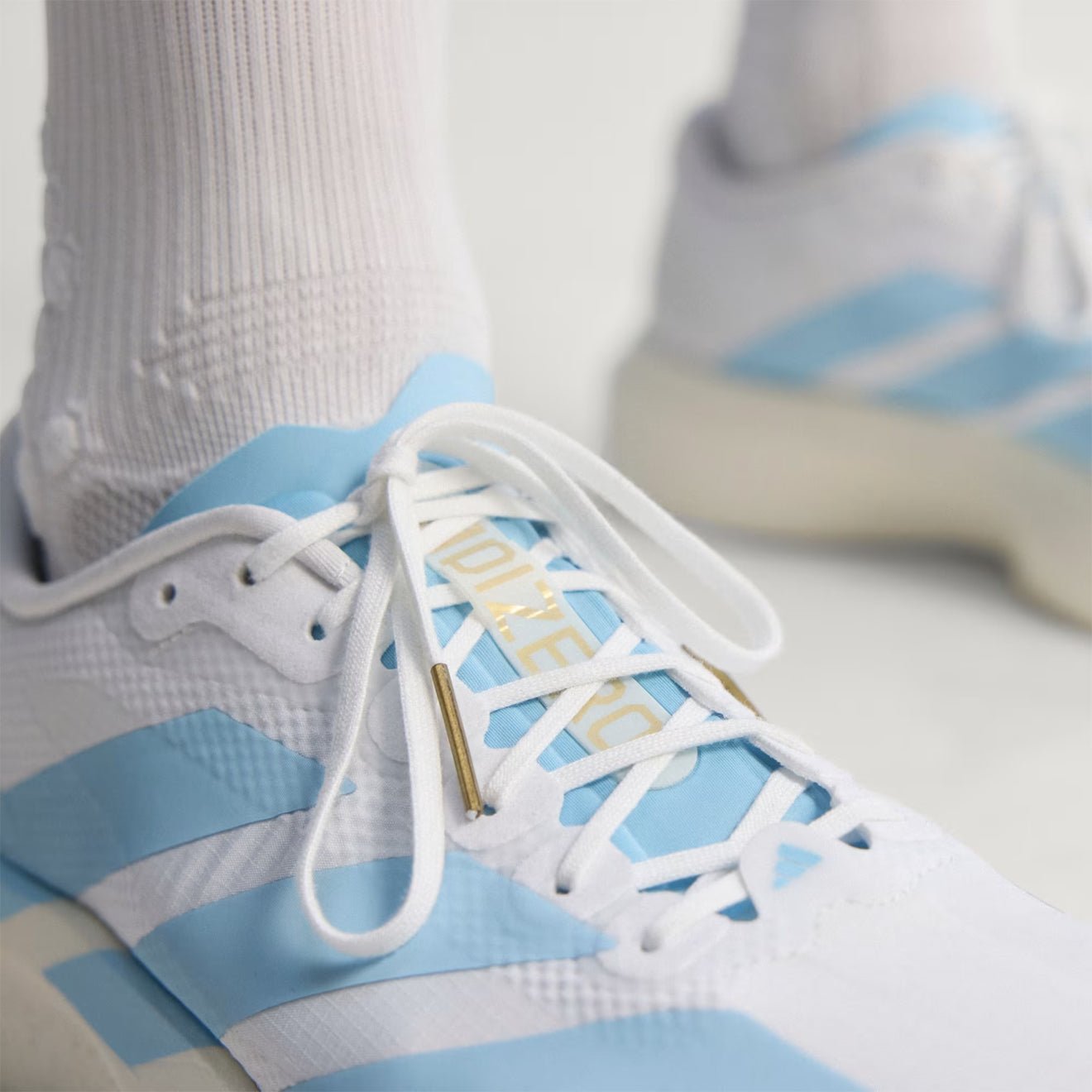 Adidas Adizero Evo SL Woven Trainer Cloud White / Clear Blue / Matte Gold - The Sporting Lodge