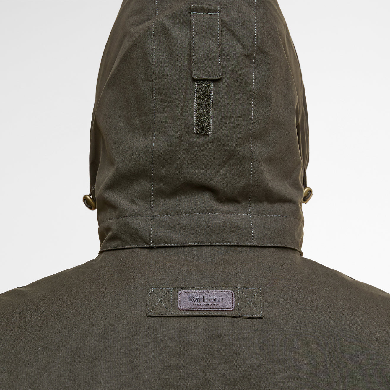 Barbour Brockstone Jacket Dark Olive men’s rear hood detail with logo patch and fabric finish